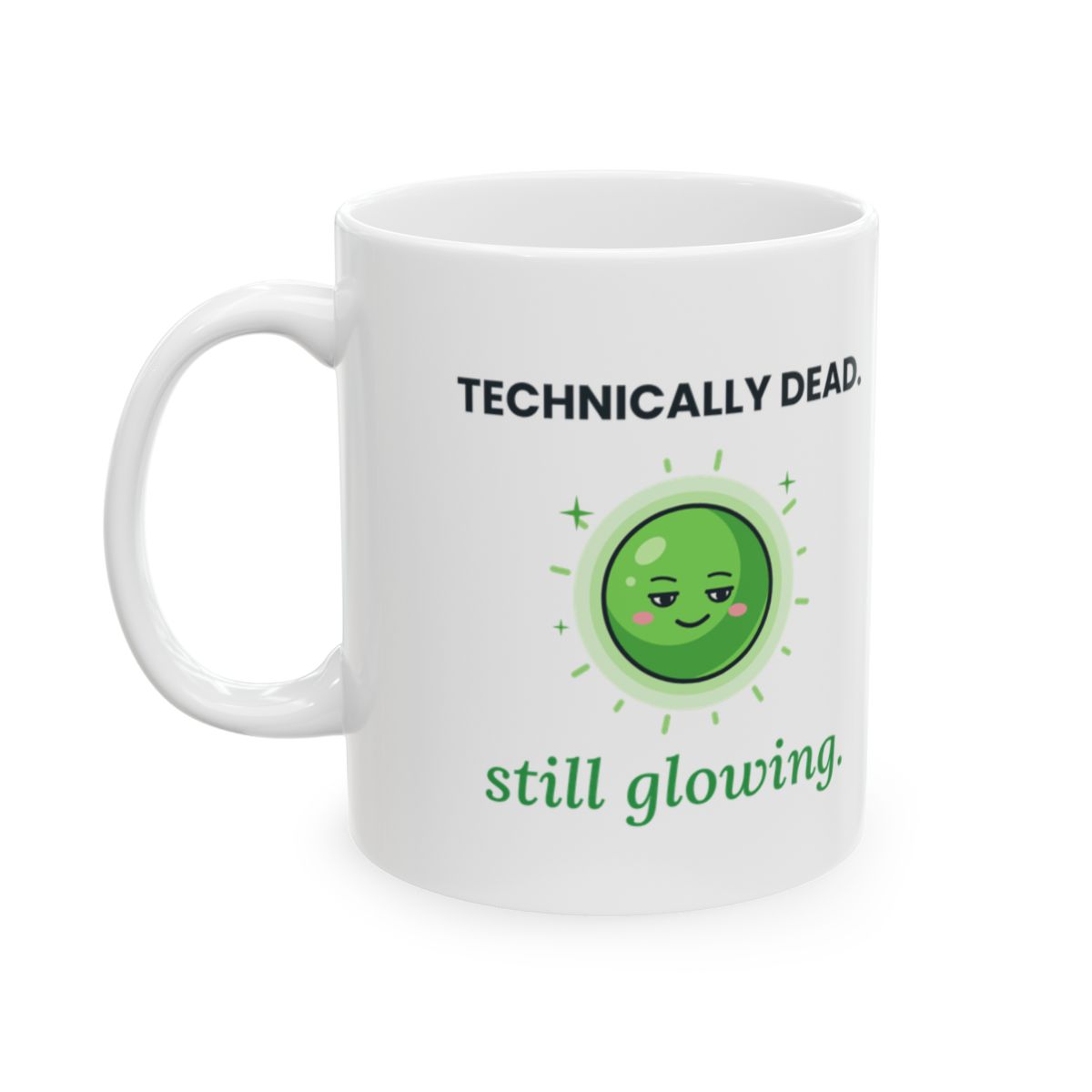 White 11 oz mug printed with a calm, glowing green star with light rays between TECHNICALLY DEAD. and still glowing.