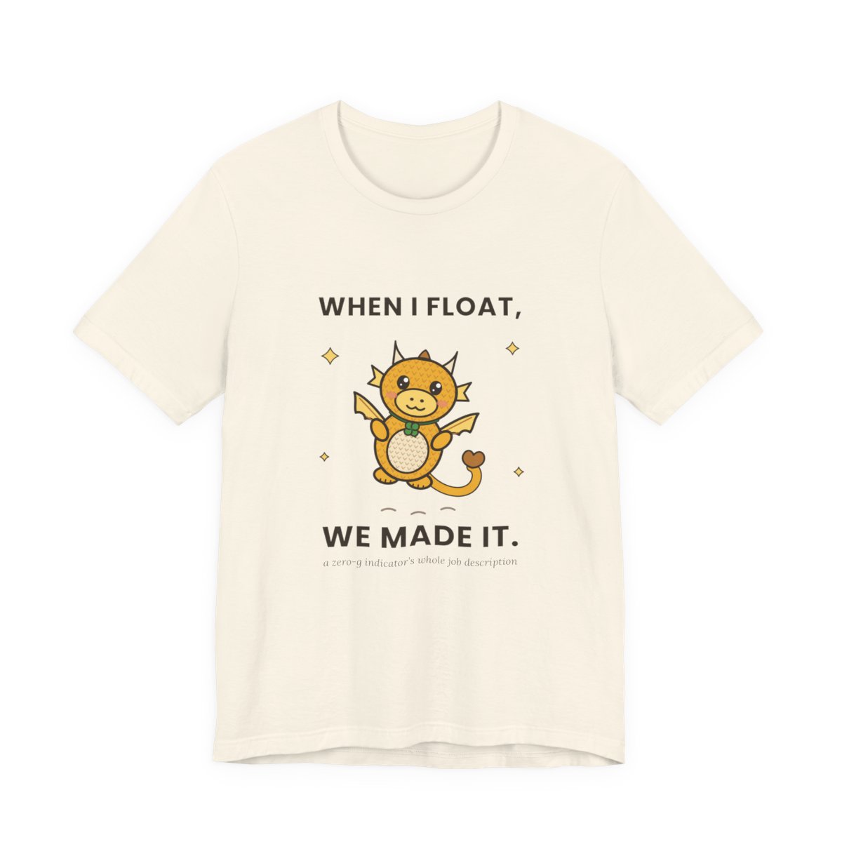 Natural-color t-shirt mockup reading WHEN I FLOAT, WE MADE IT. around a floating golden crocheted dragon